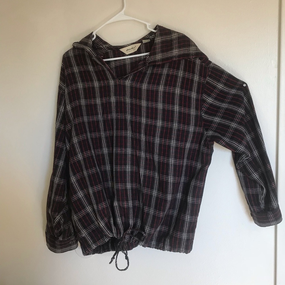 Plaid hooded Eddie Bauer woman’s flannel shirt.